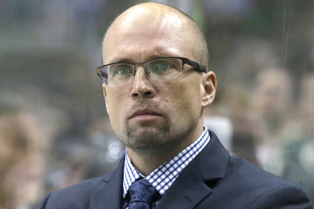 Minnesota Wild head coach Mike Yeo watches from the bench during the first period of an NHL hockey game against the Dallas Stars Saturday, Jan. 9, 2016, in Dallas. (AP Photo/LM Otero)