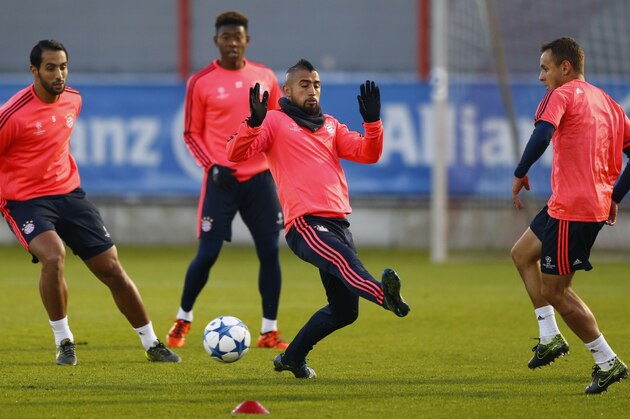 Bayern's Mehdi Benatia, from left, David Alaba, Arturo Vidal and Rafinha practice during a training session prior to the Champions League Group F soccer match against FC Arsenal in Munich, Germany, Tuesday Nov. 3, 2015. Bayern will face Arsenal Wednesday. (AP Photo/Matthias Schrader) Bayern's Mehdi Benatia, from left, David Alaba, Arturo Vidal and Rafinha practice during a training session prior to the Champions League Group F soccer match against FC Arsenal in Munich, Germany, Tuesday Nov. 3, 2015. Bayern will face Arsenal Wednesday. (AP Photo/Matthias Schrader)
