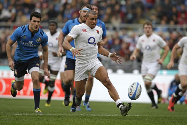 England’s Jonathan Joseph races clear to score his second try during the Six Nations rugby union match between Italy and England, in Rome's Olympic stadium, Sunday, Feb. 14, 2016. (AP Photo/Andrew Medichini)