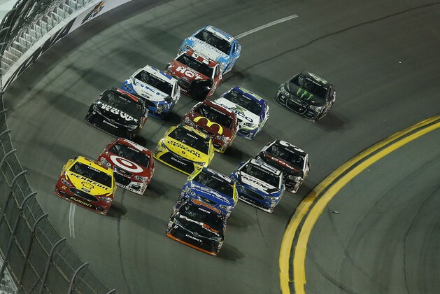 DAYTONA BEACH, FL - FEBRUARY 13:  Denny Hamlin, driver of the #11 FedEx Express Toyota, and Joey Logano, driver of the #22 Shell Pennzoil Ford, lead a pack of cars during the NASCAR Sprint Cup Series Sprint Unlimited at Daytona International Speedway on February 13, 2016 in Daytona Beach, Florida.  (Photo by Matt Sullivan/Getty Images)