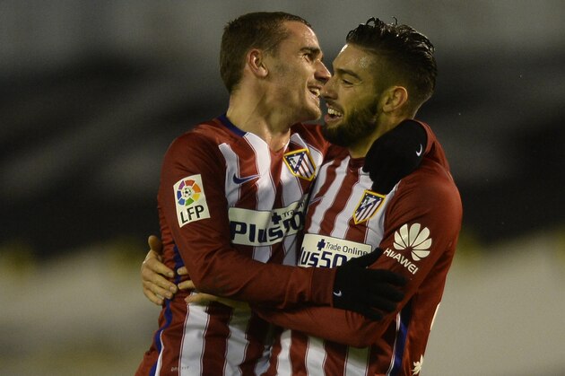 Atletico Madrid's Belgian midfielder Yannick Ferreira Carrasco (R) celebrates with teammate French forward Antoine Griezmann after scoring during the Spanish league football match RC Celta de Vigo vs Club Atletico de Madrid at the Balaidos stadium in Vigo on January 10, 2016. Atletico won the match 2-0.   AFP PHOTO/ MIGUEL RIOPA / AFP / MIGUEL RIOPA        (Photo credit should read MIGUEL RIOPA/AFP/Getty Images)