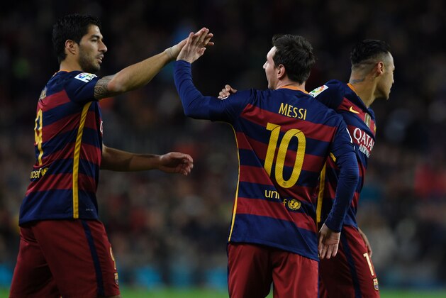 Barcelona's Argentinian forward Lionel Messi (C) celebrates a goal with Barcelona's Uruguayan forward Luis Suarez (L) and Barcelona's Brazilian forward Neymar during the Spanish league football match FC Barcelona vs RC Celta de Vigo at the Camp Nou stadium in Barcelona on February 14, 2016. / AFP / LLUIS GENE        (Photo credit should read LLUIS GENE/AFP/Getty Images)