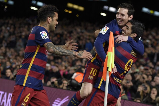 Barcelona's Uruguayan forward Luis Suarez (R) celebrates a goal with Barcelona's Argentinian forward Lionel Messi (C) and Barcelona's Brazilian defender Dani Alves during the Spanish league football match FC Barcelona vs RC Celta de Vigo at the Camp Nou stadium in Barcelona on February 14, 2016.

 / AFP / LLUIS GENE        (Photo credit should read LLUIS GENE/AFP/Getty Images)