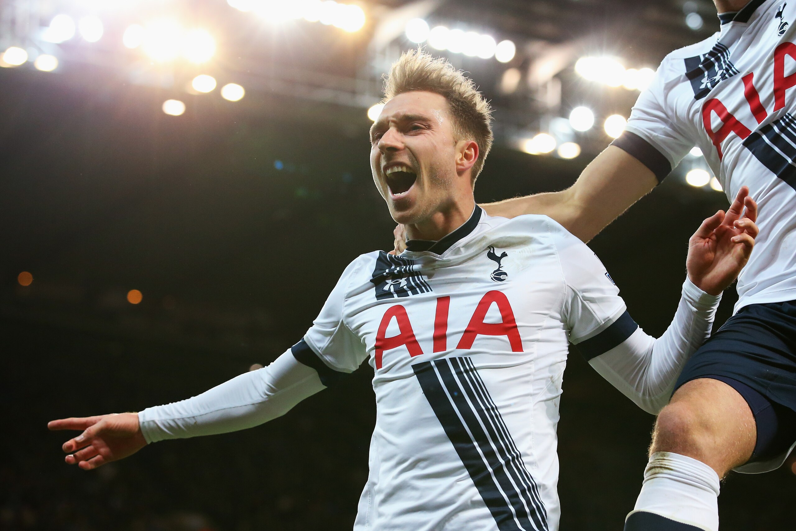 MANCHESTER, ENGLAND - FEBRUARY 14:  Christian Eriksen (L) of Tottenham Hotspur celebrates scoring his team's second goal during the Barclays Premier League match between Manchester City and Tottenham Hotspur at Etihad Stadium on February 14, 2016 in Manchester, England.  (Photo by Alex Livesey/Getty Images)
