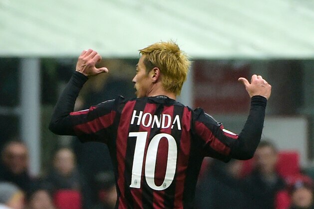 AC Milan's Japanese midfielder Keisuke Honda celebrates after scoring during the Italian Serie A football match AC Milan vs Genoa on February 14, 2016 at the San Siro Stadium stadium in Milan.  / AFP / OLIVIER MORIN        (Photo credit should read OLIVIER MORIN/AFP/Getty Images)