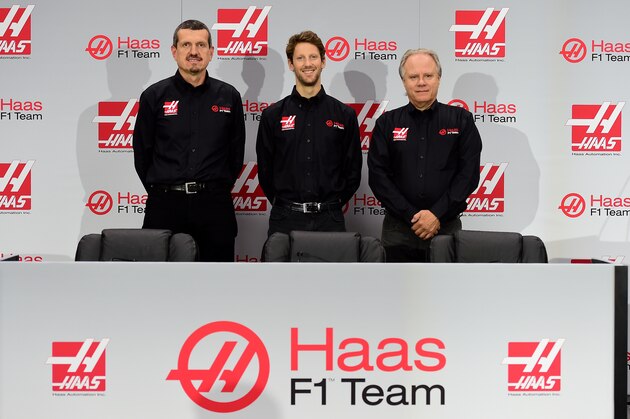 KANNAPOLIS, NC - SEPTEMBER 29:  (L-R) Gunther Steiner, team principal of Haas F1 Team, Romain Grosjean of France, and Gene Haas, owner of Haas F1 Team, pose for a photo opportunity after Haas F1 Team announced Grosjean as their driver for the upcoming 2016 Formula 1 season on September 29, 2015 in Kannapolis, North Carolina.  (Photo by Jared C. Tilton/Stewart-Haas Racing via Getty Images)