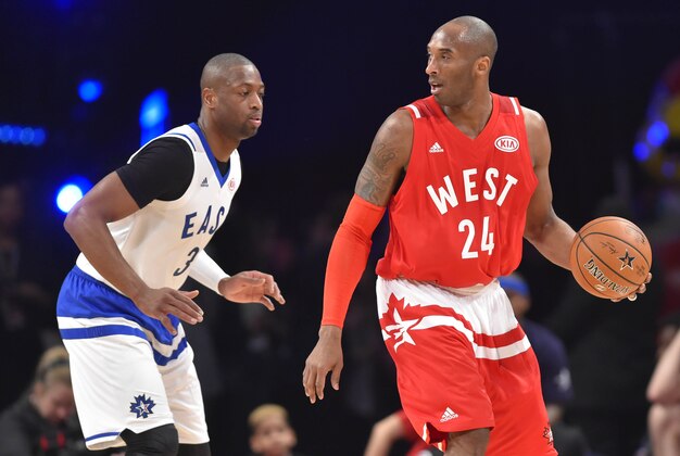Feb 14, 2016; Toronto, Ontario, CAN; Western Conference forward Kobe Bryant of the Los Angeles Lakers (24) controls the ball against Eastern Conference guard Dwyane Wade of the Miami Heat (3) in the second half during the NBA All Star Game at Air Canada Centre. Mandatory Credit: Bob Donnan-USA TODAY Sports