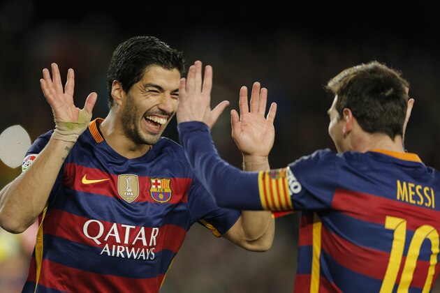 FC Barcelona's Luis Suarez, left, reacts after scoring with his teammate Lionel Messiagainst Celta Vigo during a Spanish La Liga soccer match at the Camp Nou stadium in Barcelona, Spain, Sunday, Feb. 14, 2016. (AP Photo/Manu Fernandez)