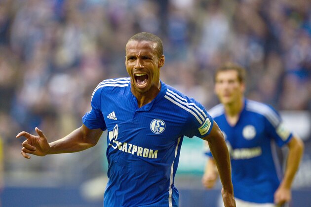 Schalke's Cameroonian defender Joel Matip celebrates after scoring the 1-0 goal during the German first division Bundesliga football match FC Schalke 04 v 1 FSV Mainz 05, in Gelsenkirchen, on September 13, 2015.  AFP PHOTO / SASCHA SCHUERMANN  RESTRICTIONS: DURING MATCH TIME: DFL RULES TO LIMIT THE ONLINE USAGE TO 15 PICTURES PER MATCH AND FORBID IMAGE SEQUENCES TO SIMULATE VIDEO.  == RESTRICTED TO EDITORIAL USE == FOR FURTHER QUERIES PLEASE CONTACT DFL DIRECTLY AT + 49 69 650050.        (Photo credit should read SASCHA SCHUERMANN/AFP/Getty Images)