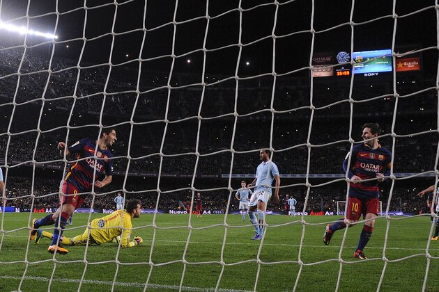 Barcelona's Uruguayan forward Luis Suarez (L) celebrates his goal after a penalty kick with Barcelona's Argentinian forward Lionel Messi during the Spanish league football match FC Barcelona vs RC Celta de Vigo at the Camp Nou stadium in Barcelona on February 14, 2016.

 / AFP / JOSEP LAGO        (Photo credit should read JOSEP LAGO/AFP/Getty Images)