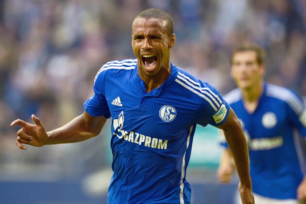 Schalke's Cameroonian defender Joel Matip celebrates after scoring the 1-0 goal during the German first division Bundesliga football match FC Schalke 04 v 1 FSV Mainz 05, in Gelsenkirchen, on September 13, 2015.  AFP PHOTO / SASCHA SCHUERMANN  RESTRICTIONS: DURING MATCH TIME: DFL RULES TO LIMIT THE ONLINE USAGE TO 15 PICTURES PER MATCH AND FORBID IMAGE SEQUENCES TO SIMULATE VIDEO.  == RESTRICTED TO EDITORIAL USE == FOR FURTHER QUERIES PLEASE CONTACT DFL DIRECTLY AT + 49 69 650050.        (Photo credit should read SASCHA SCHUERMANN/AFP/Getty Images)