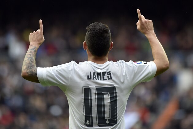 Real Madrid's Colombian midfielder James Rodriguez celebrates after scoring during the Spanish league football match Real Madrid CF vs Athletic Club Bilbao at the Santiago Bernabeu stadium in Madrid on February 13, 2016. / AFP / GERARD JULIEN        (Photo credit should read GERARD JULIEN/AFP/Getty Images)