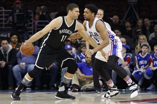 Brooklyn Nets' Brook Lopez (11) in action against Philadelphia 76ers' Jahlil Okafor (8) during the first half of an NBA basketball game, Saturday, Feb. 6, 2016, in Philadelphia. The 76ers won 103-98. (AP Photo/Chris Szagola)