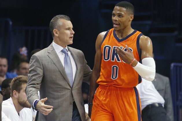 Oklahoma City Thunder head coach Billy Donovan, left, talks with Russell Westbrook in the second half of an NBA basketball game against the Denver Nuggets in Oklahoma City, Sunday, Nov. 1, 2015. Oklahoma City won 117-93. (AP Photo/Sue Ogrocki)