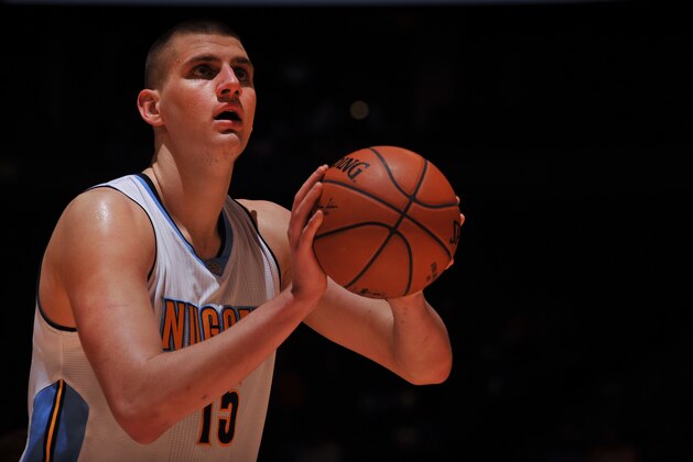 DENVER, CO - FEBRUARY 1:  Nikola Jokic #15 of the Denver Nuggets prepares to shoot a free throw against the Toronto Raptors on February 1, 2016 at the Pepsi Center in Denver, Colorado. NOTE TO USER: User expressly acknowledges and agrees that, by downloading and/or using this Photograph, user is consenting to the terms and conditions of the Getty Images License Agreement. Mandatory Copyright Notice: Copyright 2016 NBAE (Photo by Bart Young/NBAE via Getty Images)