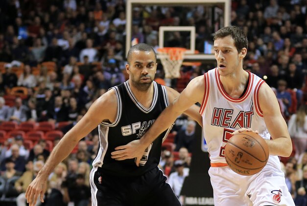 Feb 9, 2016; Miami, FL, USA; Miami Heat guard Goran Dragic (7) dribbles past San Antonio Spurs guard Tony Parker (9) during the first half at American Airlines Arena. Mandatory Credit: Steve Mitchell-USA TODAY Sports