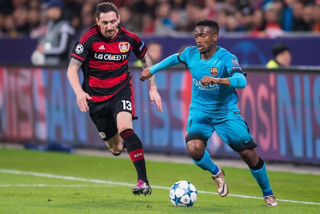 (L-R) Roberto Hilbert of Bayer 04 Leverkusen, Wilfrid Kaptoum of FC Barcelona during the UEFA Champions League match between Bayer 04 Leverkusen and FC Barcelona on December 9, 2015 at the BayArena in Leverkusen, Germany.(Photo by VI Images via Getty Images)