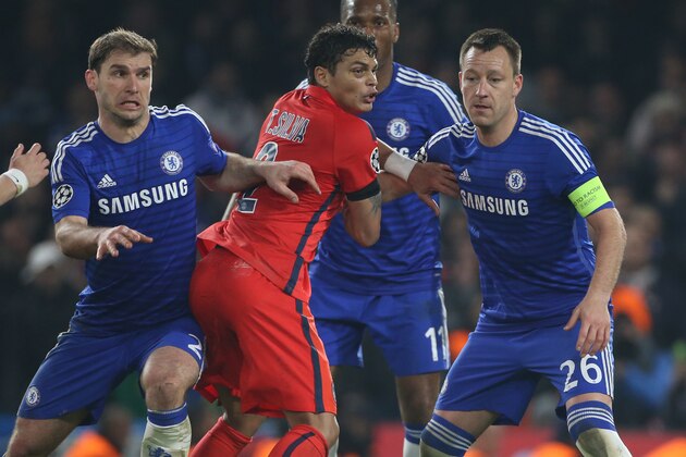 LONDON, ENGLAND - MARCH 11: Thiago Silva of PSG in action between Branislav Ivanovic and John Terry of Chelsea during the UEFA Champions League Round of 16, second leg match between Chelsea FC and Paris Saint-Germain FC at Stamford Bridge stadium on March 11, 2015 in London, England. (Photo by Jean Catuffe/Getty Images)