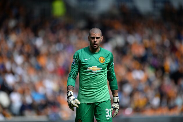 Manchester United's Spanish goalkeeper Victor Valdes plays during the English Premier League football match between Hull City and Manchester United at the KC Stadium in Kingston upon Hull, north east England on May 24, 2015.  AFP PHOTO / OLI SCARFF  RESTRICTED TO EDITORIAL USE. NO USE WITH UNAUTHORIZED AUDIO, VIDEO, DATA, FIXTURE LISTS, CLUB/LEAGUE LOGOS OR LIVE SERVICES. ONLINE IN-MATCH USE LIMITED TO 45 IMAGES, NO VIDEO EMULATION. NO USE IN BETTING, GAMES OR SINGLE CLUB/LEAGUE/PLAYER PUBLICATIONS.        (Photo credit should read OLI SCARFF/AFP/Getty Images)