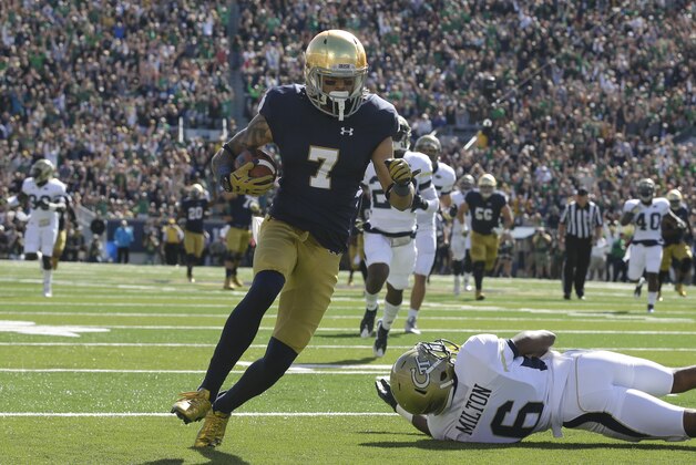 Notre Dame wide receiver Will Fuller (7) heads to the end zone for a touchdown after getting past Georgia Tech defensive back Chris Milton (6) during the first half of an NCAA college football game in South Bend, Ind., Saturday, Sept. 19, 2015. (AP Photo/Michael Conroy)