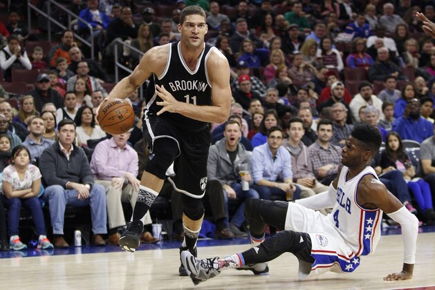 Brooklyn Nets' Brook Lopez (11) in action against Philadelphia 76ers' Nerlens Noel (4) during the second half of an NBA basketball game, Saturday, Feb. 6, 2016, in Philadelphia. The 76ers won 103-98. (AP Photo/Chris Szagola)