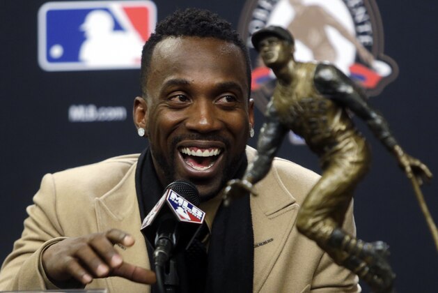 Pittsburgh Pirates Andrew McCutchen smiles at a news conference where he was announced the Roberto Clemente Award winner for 2015 before Game 3 of the Major League Baseball World Series between the New York Mets and the Kansas City Royals Friday, Oct. 30, 2015, in New York. (AP Photo/Frank Franklin II)