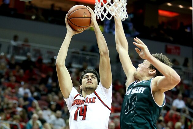LOUISVILLE, KY - DECEMBER 23:  Anas Mahmoud #14 of the Louisville Cardinals shoots the ball during the game against the Utah Valley Wolverines in the Billy Minardi Classic at KFC YUM! Center on December 23, 2015 in Louisville, Kentucky.  (Photo by Andy Lyons/Getty Images)
