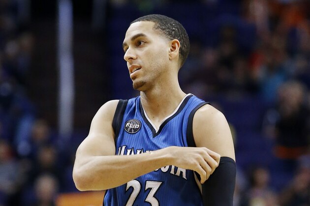Minnesota Timberwolves' Kevin Martin adjusts an arm sleeve during the first half of an NBA basketball game against the Phoenix Suns Sunday, Dec. 13, 2015, in Phoenix.  The Suns defeated the Timberwolves 108-101. (AP Photo/Ross D. Franklin)