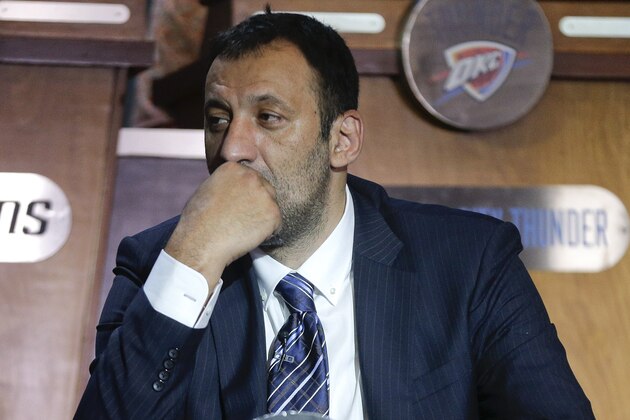 Vlade Divac, Sacramento Kings vice president of basketball and franchise operations, listens for the Kings' position in the NBA basketball daft, during the draft lottery Tuesday, May 19, 2015, in New York. (AP Photo/Julie Jacobson)