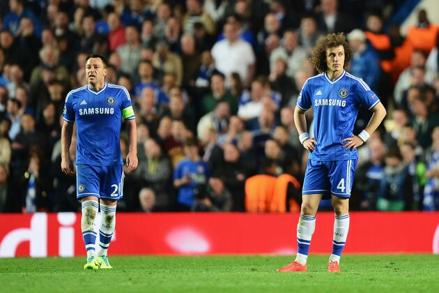 LONDON, ENGLAND - APRIL 30:  John Terry (L) and David Luiz of Chelsea look dejected during the UEFA Champions League semi-final second leg match between Chelsea and Club Atletico de Madrid at Stamford Bridge on April 30, 2014 in London, England.  (Photo by Jamie McDonald/Getty Images)