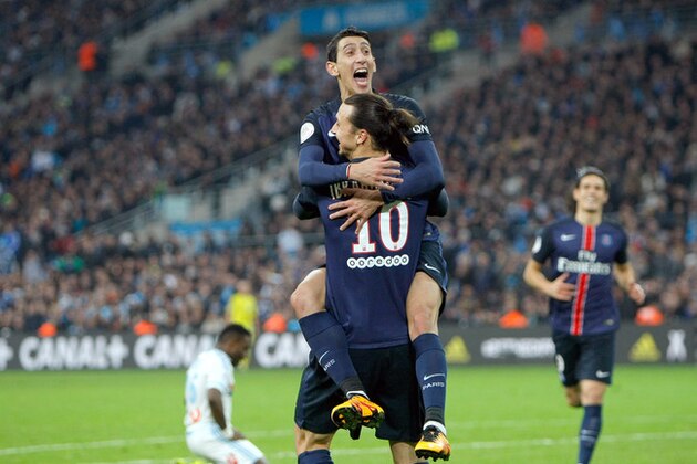 Paris Saint Germain's Angel Di Maria, top, celebrates with teammate Zlatan Ibrahimovic after scoring against Marseille, during the League One soccer match between Marseille and Paris Saint-Germain, at the Velodrome Stadium, in Marseille, southern France, Sunday, Feb. 7, 2016. (AP Photo/Claude Paris)