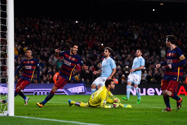 BARCELONA, SPAIN - FEBRUARY 14:  (L-R) Luis Suarez of FC Barcelona celebrates with his team mate Lionel Messi of FC Barcelona after scoring his team's fourth goal from the penalty spot during the La Liga match between FC Barcelona and Celta Vigo at Camp Nou on February 14, 2016 in Barcelona, Spain. Messi took the penalty, tapping the ball softly forward for Suarez to run up and score. (Photo by David Ramos/Getty Images)