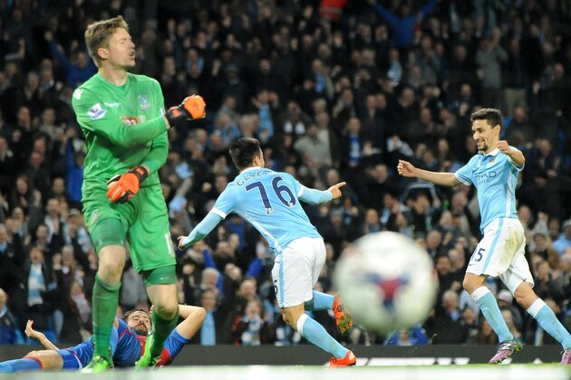 Manchester City’s Manuel Garcia, centre left, celebrates with Manchester City’s Jesus Navas after scoring against Crystal Palace during the English League Cup Fourth Round soccer match between Manchester City and Crystal Palace at the Etihad Stadium, Manchester, England, Wednesday, Oct. 28, 2015. (AP Photo/Rui Vieira)