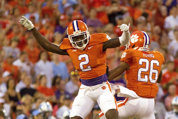 Sep 27, 2014; Clemson, SC, USA; Clemson Tigers cornerback MacKensie Alexander (2) and cornerback Garry Peters (26) celebrate after breaking up a pass during the first quarter against the North Carolina Tar Heels at Clemson Memorial Stadium. Mandatory Credit: Joshua S. Kelly-USA TODAY Sports