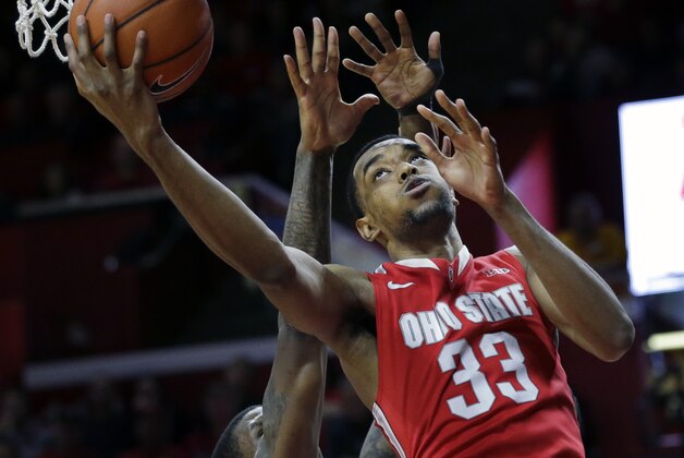 Ohio State forward  Keita Bates-Diop, right, shoots a basket past Rutgers forward Greg Lewis during the second half of an NCAA college basketball game Saturday, Feb. 13, 2016, in Piscataway, N.J. Ohio State won 79-69. (AP Photo/Mel Evans)