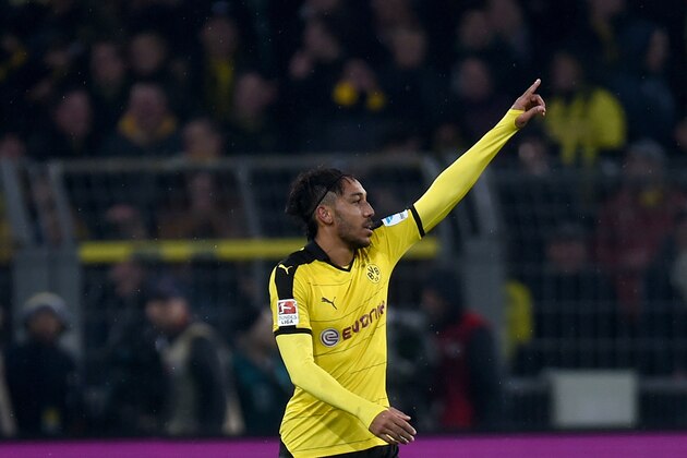 Dortmund's Gabonese striker Pierre-Emerick Aubameyang celebrates during the German first division Bundesliga football match of Borussia Dortmund vs FC Ingolstadt 04 in Dortmund, western Germany, on January 30, 2016. 
Dortmund won the match 2-0. / AFP / PATRIK STOLLARZ / RESTRICTIONS: DURING MATCH TIME: DFL RULES TO LIMIT THE ONLINE USAGE TO 15 PICTURES PER MATCH AND FORBID IMAGE SEQUENCES TO SIMULATE VIDEO. == RESTRICTED TO EDITORIAL USE == FOR FURTHER QUERIES PLEASE CONTACT DFL DIRECTLY AT + 49 69 650050
        (Photo credit should read PATRIK STOLLARZ/AFP/Getty Images)