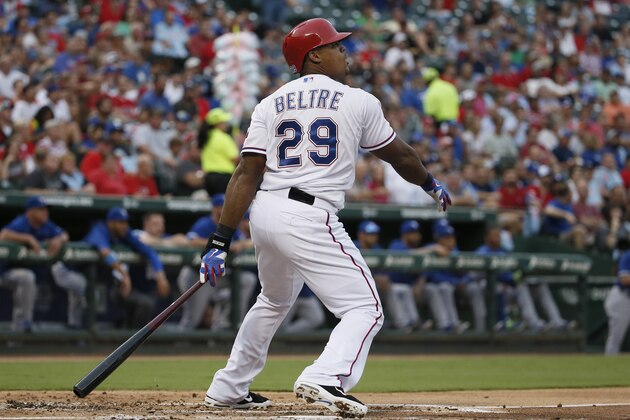 Texas Rangers' Adrian Beltre watches his triple off Toronto Blue Jays' Mark Buehrle during the first inning of a baseball game, Tuesday, Aug. 25, 2015, in Arlington, Texas. (AP Photo/Tony Gutierrez)