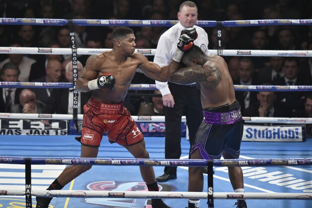 LONDON, ENGLAND - DECEMBER 12:  Anthony Joshua MBE (L) in boxing action against Dillian Whyte during the Commonwealth Heavyweight title, Vacant British Heavyweight title and WBC International Heavyweight title fight at The O2 Arena on December 12, 2015 in London, England.  (Photo by Leigh Dawney/Getty Images) *** Local Caption ***Anthony Joshua MBE; Dillian Whyte