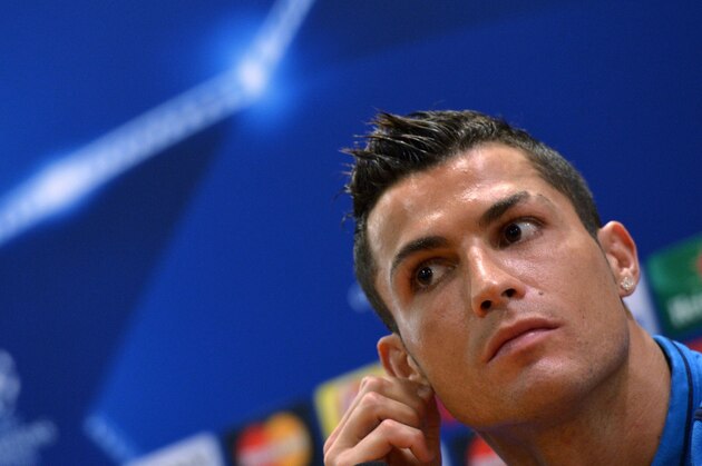 Real Madrid's Portuguese forward Cristiano Ronaldo listens to journalists' questions during a press conference at the Olympic Stadium in Rome on February 16, 2016, on the eve of their UEFA Champions League round of sixteen first leg football match against AS Roma. / AFP / TIZIANA FABI        (Photo credit should read TIZIANA FABI/AFP/Getty Images)