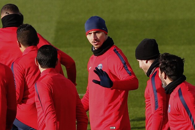 PSG players with Zlatan Ibrahimovic, center, attend a training session at Camp des Loges training center in Saint-Germain-en-Laye, outside Paris, Monday, Feb, 15, 2016. Paris Saint-Germain will face Chelsea in a Champions League soccer match on Tuesday, Feb. 16. (AP Photo/Christophe Ena)