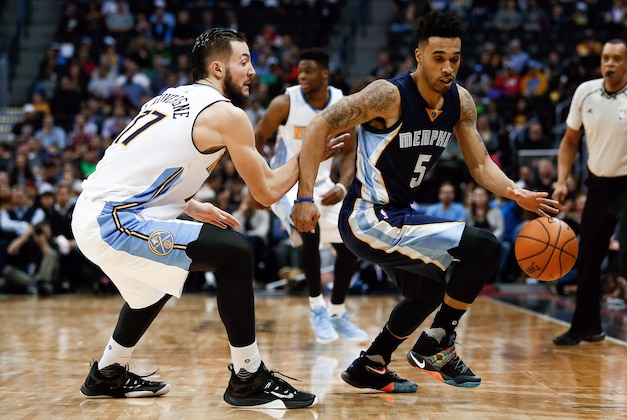 Jan 21, 2016; Denver, CO, USA; Memphis Grizzlies guard Courtney Lee (5) dribbles the ball against Denver Nuggets center Joffrey Lauvergne (77) in the fourth quarter at the Pepsi Center. The Grizzlies defeated the Nuggets 102-101. Mandatory Credit: Isaiah J. Downing-USA TODAY Sports