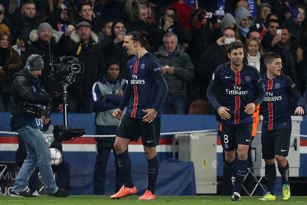 PARIS - FEBRUARY 16: Zlatan Ibrahimovic of PSG (left) celebrates scoring the first goal during the UEFA Champions League round of 16 first leg match between Paris Saint-Germain (PSG) and Chelsea FC at Parc des Princes stadium on February 16, 2016 in Paris, France. (Photo by Jean Catuffe/Getty Images)