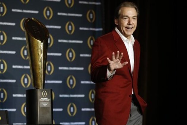 Alabama head coach Nick Saban  poses with the championship trophy during a news conference for the NCAA college football playoff championship Tuesday, Jan. 12, 2016, in Scottsdale, Ariz. Alabama beat Clemson 45-40 to win the championship. (AP Photo/Morry Gash)