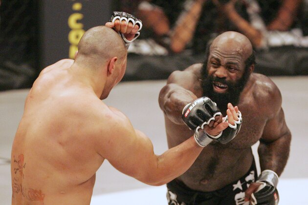 Kimbo Slice, right, throws a punch at James Thompson of Manchester, England during the second round of their EliteXC heavyweight bout at the Prudential Center in Newark, N.J. Saturday, May 31, 2008. Slice won in the third round on a TKO. (AP Photo/Rich Schultz)