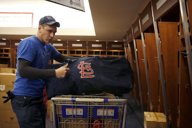 Dustin Heddy with United Van Lines packs up gear in the St. Louis Cardinals clubhouse to be sent to the baseball team's spring training facility Thursday, Feb. 11, 2016, in St. Louis. Cardinals pitchers and catchers are scheduled to report to camp on Feb. 17, 2016, in Jupiter, Fla. (AP Photo/Jeff Roberson)