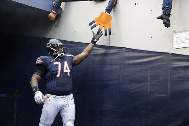 Chicago Bears tackle Jermon Bushrod (74) greets fans during introductions before an NFL football game against the Detroit Lions, Sunday, Jan. 3, 2016, in Chicago. (AP Photo/Nam Y. Huh)