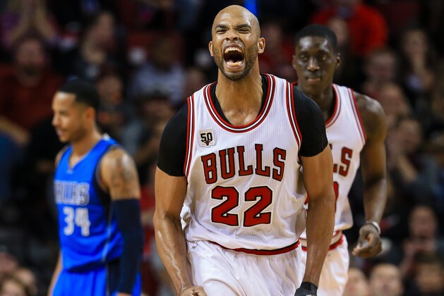 Chicago Bulls' Taj Gibson (22) reacts after scoring against the Dallas Mavericks during the second half of an NBA preseason basketball game in Lincoln, Neb., Friday, Oct. 23, 2015. (AP Photo/Nati Harnik)
