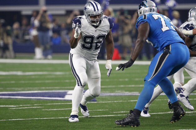 Dallas Cowboys defensive end Jeremy Mincey (92) rushes against Carolina Panthers' Michael Oher (73) during an NFL football game Thursday, Nov. 26, 2015, in Arlington, Texas. (AP Photo/Roger Steinman)