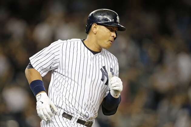 New York Yankees designated hitter Alex Rodriguez after hitting a solo-home run off Boston Red Sox pitcher Matt Barnes during the sixth inning of a baseball game in New York, Wednesday, Sept. 30, 2015.   (AP Photo/Kathy Willens)
