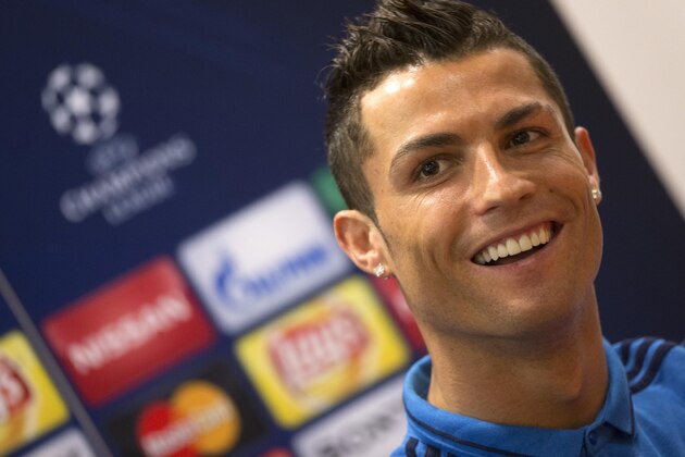 Real Madrid's Cristiano Ronaldo smiles during a press conference at the Olympic Stadium in Rome, Italy, Tuesday, Feb. 16, 2016. Real Madrid faces Roma in a UEFA Champions League soccer match Wednesday.  (Claudio Peri/ANSA via AP Photo) ITALY OUT